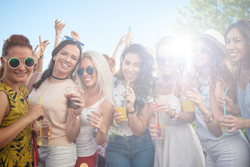 Female friends dancing at festival party outdoor