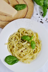 Cooked tagliatelle on a plate with pesto
