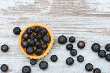 blueberry fruit cake on wood