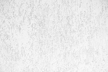 The wall of the new apartment building, plastered with beige plaster.