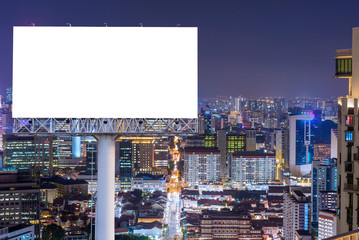 Blank billboard for advertisement in city downtown at night