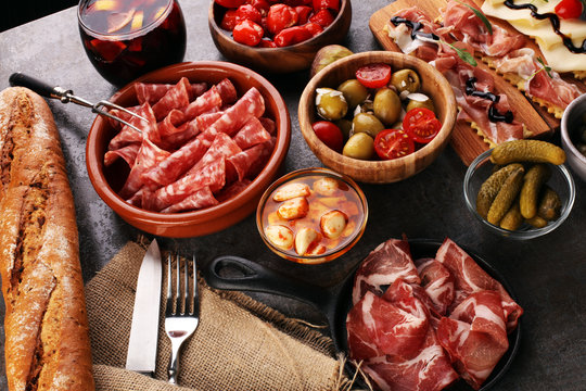 spanish tapas and sangria on wooden table - mediterran antipasti