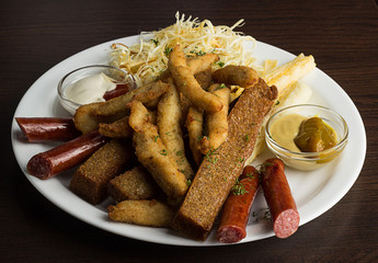 Breakfast with grilled sausages and egg