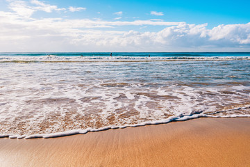 Soft wave of the sea on the sandy beach.
