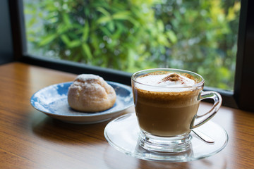 Cappuccino cup on wooden table