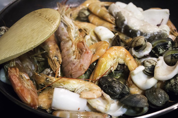 Preparing seafood for paella