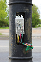 Wiring colored wires inside a pillar in a street lantern.