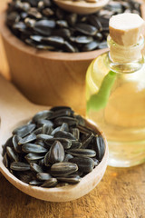 sunflower seeds and oil - closeup selective focus image 