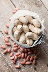 Salted peanuts on a paper bag