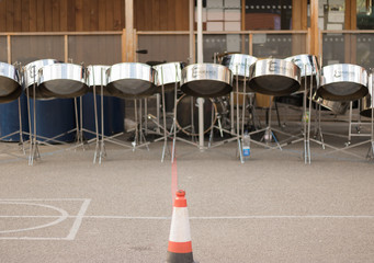 An orchestra of musical drums is ready for beginning of a concert in a schoolyard. Musical education is important for children. And drums are favourite musical instruments of youth.