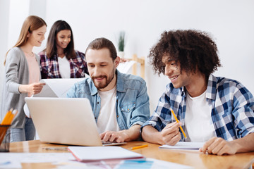 Team of young engineers working on new exciting projects