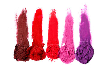 Different multi colored samples of a smudged lipstick