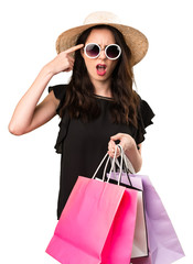 Beautiful young girl  with shopping bag making crazy gesture