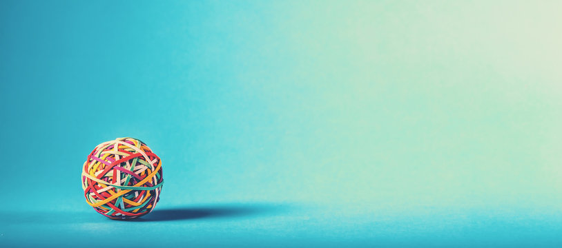 Rubber band ball on blue background