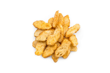 Heap of croutons from baguette with spices for beer on a white background. Top view.