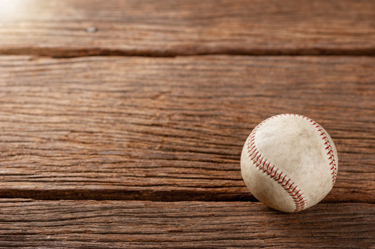 baseball on wooden desk