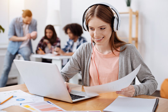 Bright inspiring woman watching educative videos