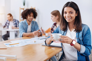 Young productive office worker enjoying a short break