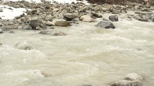 river and mountain snow. Peak Shkhara Zemo Svaneti, Georgia. The main Caucasian ridge