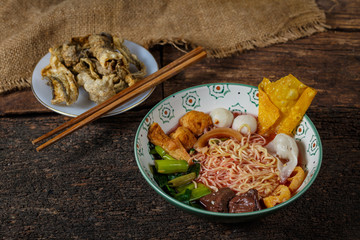 pink seafood flat noodle (Tom Yum Yen-Ta-Fo)