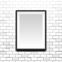 Gallery Interior with empty black frame on white old brick wall with cracks. Can be used as mock up. blank canvas in the frame