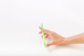 Female hands on a white background with a pen