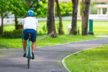 Blur Man riding bike in park  - Bangkok Thailand