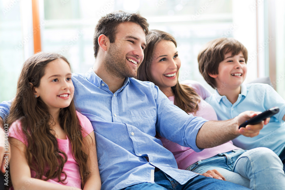 Poster Family watching TV