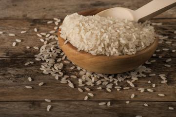 rice, jasmine rice, mali rice in Ladle and basket on the wood background