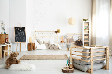 Fototapeta na wymiar Inspiring scandinavian white girl's bedroom