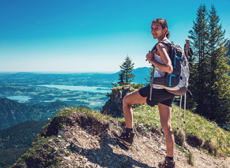 Female Hiker Ascending Steep Mountain Trail