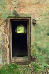 entrance to an abandoned military base in the woods