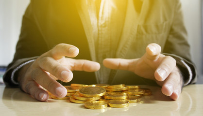 Businessman holding money coins. Business Growth concept.
