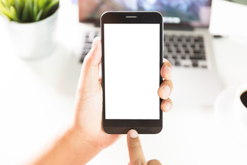 Man hands on smartphone on desk / blank screen