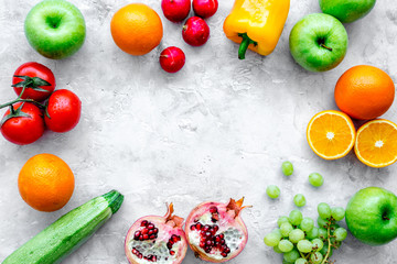 fruits and vegetables for healthy dinner on stone background top view mock up
