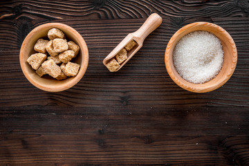 lumps of sugar with bowls sweet set on wooden table background top view mockup