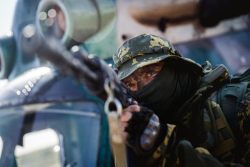 Photo of a soldier with an automatic rifle