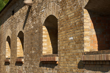 Embrasures for artillery in the brick wall of the caponier. Fragment of the fortification of the nineteenth century The Kiev Fortress