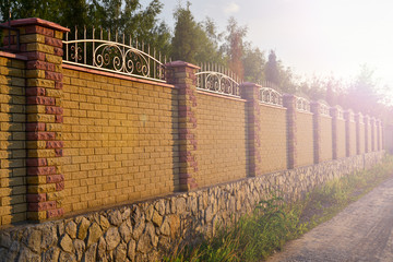 brick fence on sunset