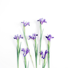 Beautiful purple iris flowers on white background. Flat lay, top view
