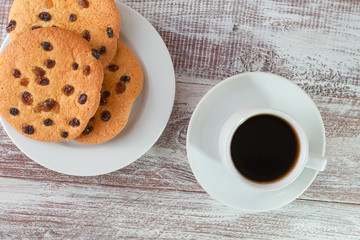 cookie chocolate and tea on a wooden table
