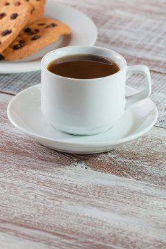 cookie chocolate and tea on a wooden table