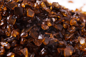 Heap of brown Amber stones on white background