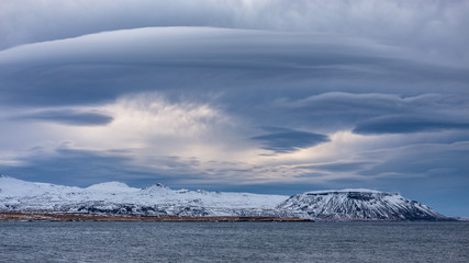 Storm clouds gathering over a mountain range, Iceland