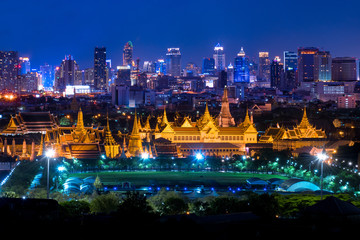 Bangkok most famous landmark "Grand Palace" with city skyline business district background.