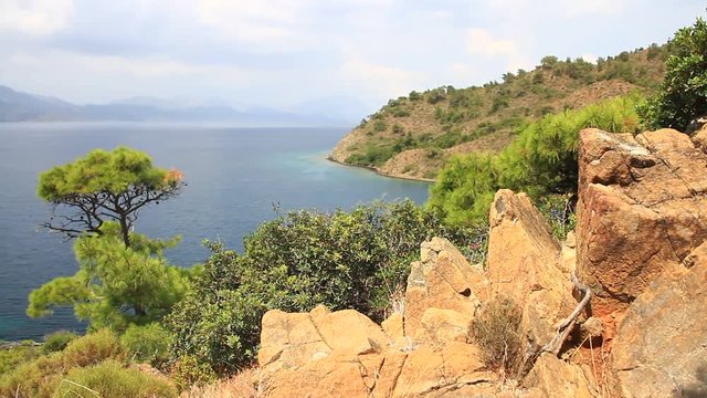 High angle panoramic shot of indented sea coastline. Complex Aegean topography, characterized by numerous islands, straits, peninsulas and combination of shallow, deep basins. 