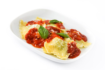 Ravioli with tomato sauce and basil isolated on white background
