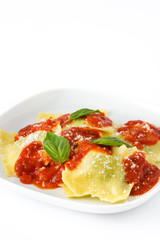 Ravioli with tomato sauce and basil isolated on white background
