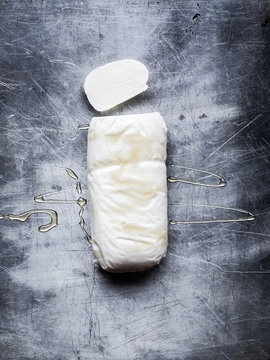 Mozzarella cheese drizzled in oil,  overhead view