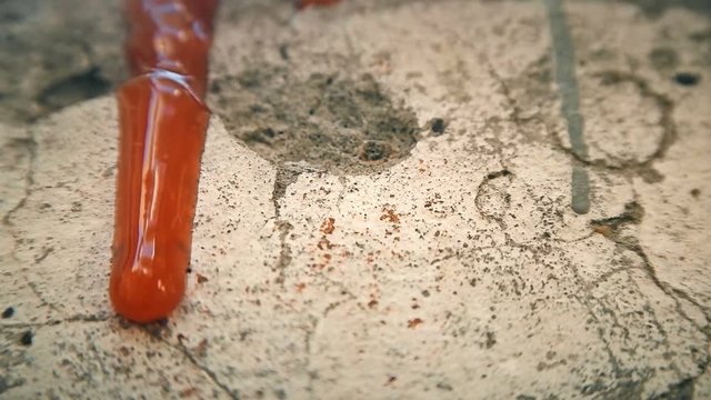 red liquid like blood dripping down the wall